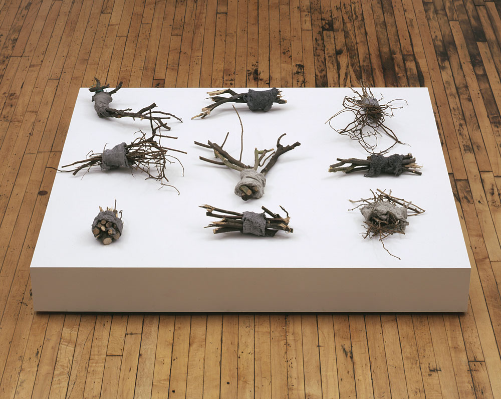 Alexandra Bircken, Calories, 2011, Wood, mortar and cloth, 9 pieces, each various dimensions, Overall 160 x 160 x 43 cm