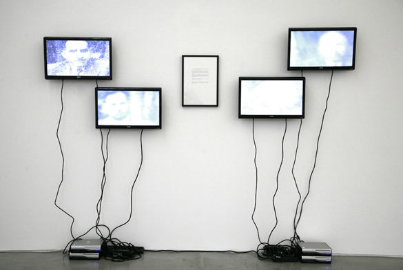 Shilpa Gupta, Hardly Bare to Speak, 2009, 4 TV monitors and a framed text piece, no sound