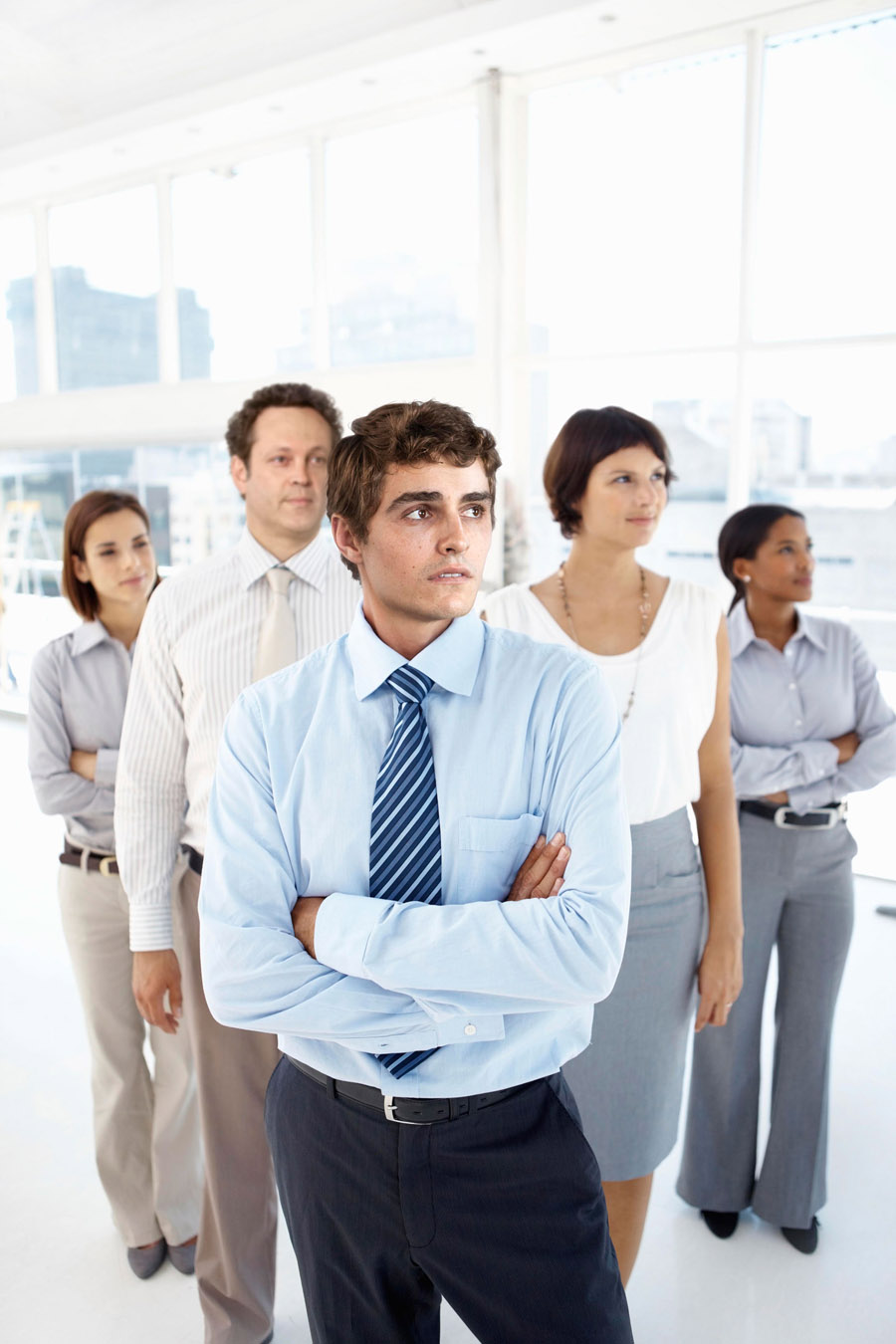 Manager with business group standing in office