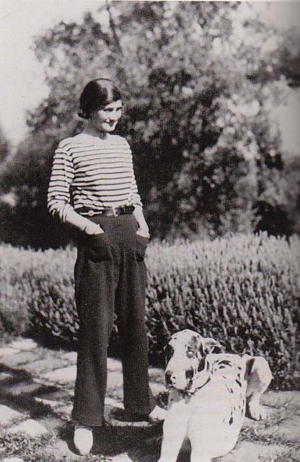Coco Chanel at Villa La Pausa in Roquebrune, French Riviera, with her dog, Gigot, c1930.