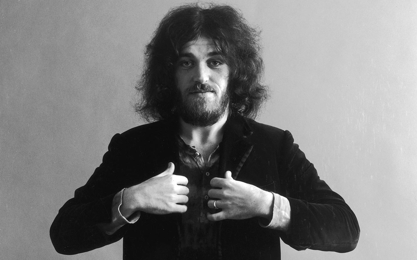 21st November 1969:  Studio portrait of British rock singer Joe Cocker holding his hands at the lapels of his jacket.  (Photo by Jack Robinson/Hulton Archive/Getty Images)
