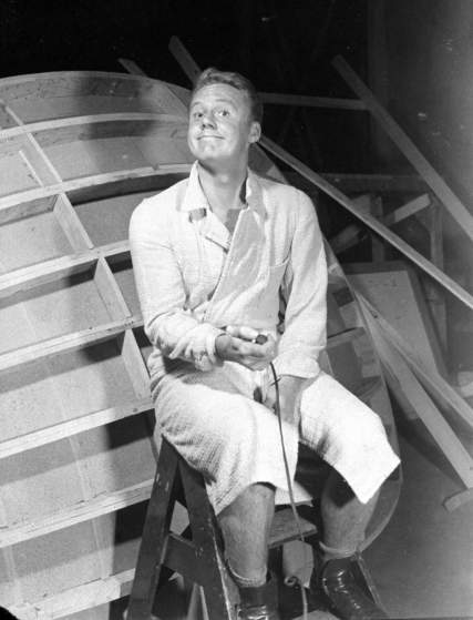 Actor Van Johnson holding shutter release as he takes his own photograph.