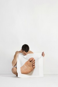 Nude Portraits Of People Holding Pictures Of Enlarged Body Parts