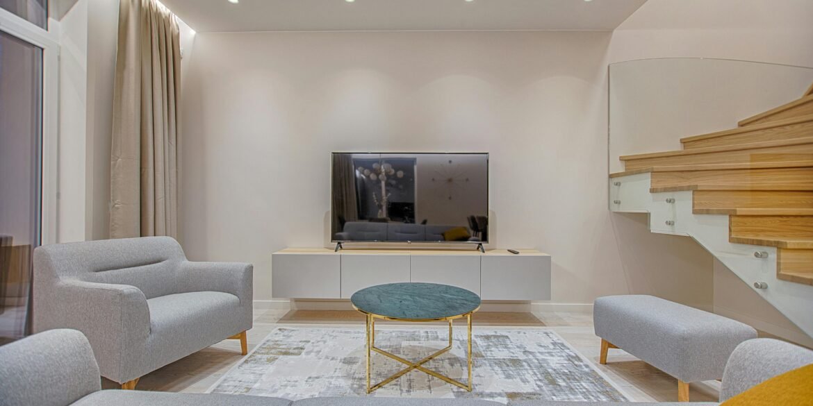 Modern living room with staircase.